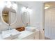 Modern bathroom with double sinks, updated vanity, and elegant mirrors at 9550 Tara Cay Ct # 17, Seminole, FL 33776