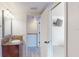 Bathroom with granite vanity and view of bedroom at 9550 Tara Cay Ct # 17, Seminole, FL 33776