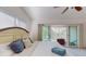 Bright bedroom with a king-size bed and ceiling fan at 9550 Tara Cay Ct # 17, Seminole, FL 33776