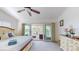 Spacious bedroom with king-size bed, private balcony access and water views at 9550 Tara Cay Ct # 17, Seminole, FL 33776