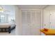 Bedroom with closet and view into bedroom at 9550 Tara Cay Ct # 17, Seminole, FL 33776