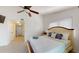 Spacious bedroom with king-size bed and access to hallway at 9550 Tara Cay Ct # 17, Seminole, FL 33776