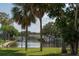 Calm canal view with boats and lush foliage at 9550 Tara Cay Ct # 17, Seminole, FL 33776