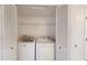 Bright laundry closet with washer and dryer in a condo at 9550 Tara Cay Ct # 17, Seminole, FL 33776