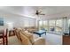 Relaxing living room with sectional sofa and access to balcony at 9550 Tara Cay Ct # 17, Seminole, FL 33776