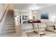 Open living room with sectional sofa and view of kitchen and dining area at 9550 Tara Cay Ct # 17, Seminole, FL 33776