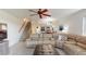 Spacious living room with large sectional sofa and access to balcony at 9550 Tara Cay Ct # 17, Seminole, FL 33776