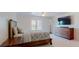 Main bedroom with king-size bed, dresser and access to a private patio at 9550 Tara Cay Ct # 17, Seminole, FL 33776