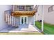 Ground level patio with spiral staircase access at 9550 Tara Cay Ct # 17, Seminole, FL 33776