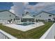 Community pool with lounge chairs and covered seating area at 9550 Tara Cay Ct # 17, Seminole, FL 33776