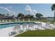 Refreshing community pool with plenty of lounge chairs at 9550 Tara Cay Ct # 17, Seminole, FL 33776