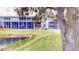 Building exterior view from across canal at 9550 Tara Cay Ct # 17, Seminole, FL 33776