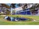 Building exterior reflected in calm canal water at 9550 Tara Cay Ct # 17, Seminole, FL 33776
