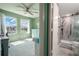View of bedroom and en-suite bathroom with a walk-in shower at 5722 Biscayne Ct # 203, New Port Richey, FL 34652