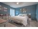 Spacious bedroom with king-size bed and access to balcony at 5722 Biscayne Ct # 203, New Port Richey, FL 34652