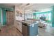 Modern kitchen with granite island and stainless steel appliances at 5722 Biscayne Ct # 203, New Port Richey, FL 34652