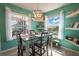 Bright dining room with table and chairs, offering water views at 5722 Biscayne Ct # 203, New Port Richey, FL 34652