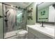 Updated bathroom with a walk-in shower and modern vanity at 5722 Biscayne Ct # 203, New Port Richey, FL 34652