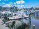 Covered boat slip with nearby waterfront community at 5722 Biscayne Ct # 203, New Port Richey, FL 34652