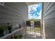 Private balcony with water views and seating for two at 5722 Biscayne Ct # 203, New Port Richey, FL 34652
