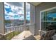 Screened balcony with outdoor seating and waterfront view at 5722 Biscayne Ct # 203, New Port Richey, FL 34652