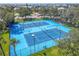 Four well-maintained tennis courts in a green space at 5722 Biscayne Ct # 203, New Port Richey, FL 34652