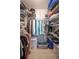 Large walk-in closet with wire shelving and hanging rods at 5722 Biscayne Ct # 203, New Port Richey, FL 34652