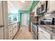 Modern kitchen with stainless steel appliances and granite counters at 5722 Biscayne Ct # 203, New Port Richey, FL 34652