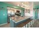 Modern kitchen with granite island and stainless steel appliances at 5722 Biscayne Ct # 203, New Port Richey, FL 34652