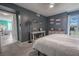 Bright bedroom with king-size bed and views to living area at 5722 Biscayne Ct # 203, New Port Richey, FL 34652