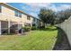 Private backyard with patio and grassy area at 10909 Keys Gate Dr, Riverview, FL 33579