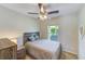 Charming bedroom with a double bed, ceiling fan and window at 1055 Jackson St, Largo, FL 33770