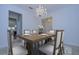 Formal dining room featuring chandelier, wood table, and seating for six at 19462 Paddock View Dr, Tampa, FL 33647
