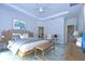 Tranquil main bedroom with light blue walls, coastal decor, and modern furnishings at 19462 Paddock View Dr, Tampa, FL 33647