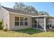 Back of home showing the screened-in porch at 26933 Carmen Pl, Lutz, FL 33559