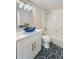 Bathroom featuring a blue vessel sink, granite countertop, and tile flooring at 26933 Carmen Pl, Lutz, FL 33559