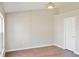 Empty bedroom with neutral paint, wood-look floors, and window at 26933 Carmen Pl, Lutz, FL 33559