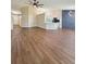 Spacious open-plan living room features sleek hardwood floors and stylish light fixtures throughout at 26933 Carmen Pl, Lutz, FL 33559