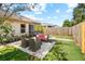 Inviting backyard with a patio seating area and a well-maintained lawn, perfect for outdoor entertaining at 2989 Brookfield Ln, Clearwater, FL 33761