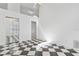 Spacious bedroom with checkered floor and mirrored closet at 2989 Brookfield Ln, Clearwater, FL 33761