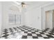 Bright bedroom with checkered floor and arched window at 2989 Brookfield Ln, Clearwater, FL 33761