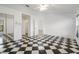 Spacious bedroom with checkered floors and mirrored closet at 2989 Brookfield Ln, Clearwater, FL 33761