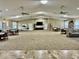 Spacious community room with seating, tables and a large TV at 2989 Brookfield Ln, Clearwater, FL 33761