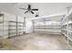 Garage with built in shelving and ceiling fan at 2989 Brookfield Ln, Clearwater, FL 33761