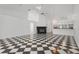 Spacious living room featuring black and white tile flooring, a fireplace, and an open floor plan at 2989 Brookfield Ln, Clearwater, FL 33761