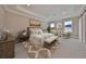 Calming main bedroom features tray ceilings, neutral color furniture, and decor at 3812 W Sevilla St, Tampa, FL 33629