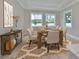 Bright dining room boasts a large table setting, neutral color chairs, and modern decor at 3812 W Sevilla St, Tampa, FL 33629