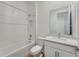 Bright bathroom featuring a shower-tub combination and modern vanity at 4656 Southern Valley Loop, Brooksville, FL 34601