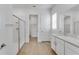 Bathroom featuring a glass shower, dual sinks and walk-in closet at 4656 Southern Valley Loop, Brooksville, FL 34601