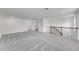 Upstairs bonus room features neutral carpet and a staircase at 4656 Southern Valley Loop, Brooksville, FL 34601
